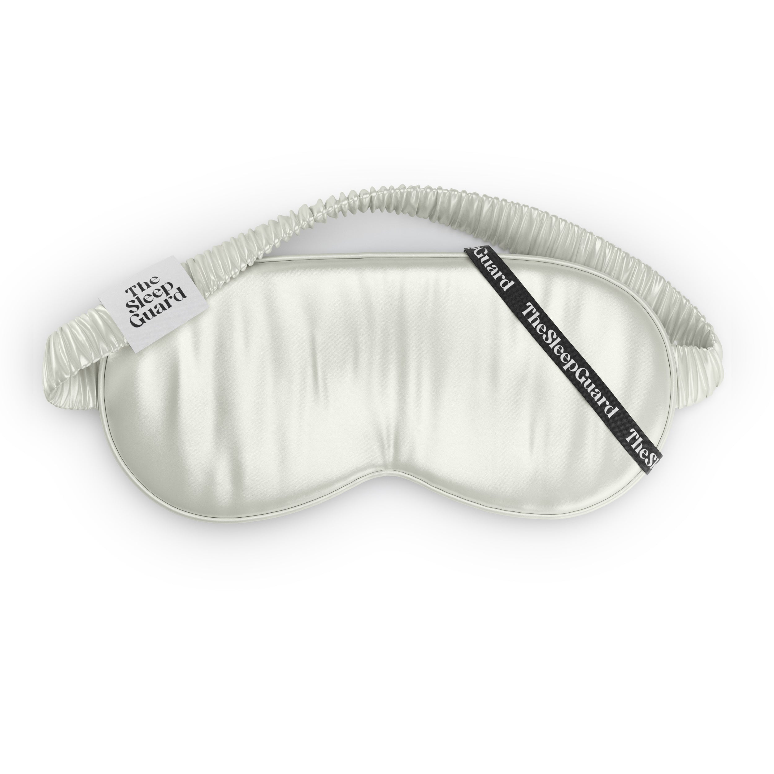 Silky ivory white sleep mask with 'The Sleep Guard' branding on a white background